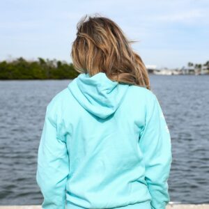 woman wearing Lock 'N Key Unisex Fleece Hooded Sweatshirt -with intracoastal waterway in the background - back view